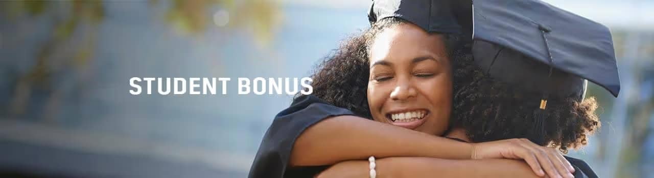 Two happy graduates in caps and gowns embrace, celebrating their achievement. The text "STUDENT BONUS" is displayed prominently beside them, highlighting a promotion or benefit for students.