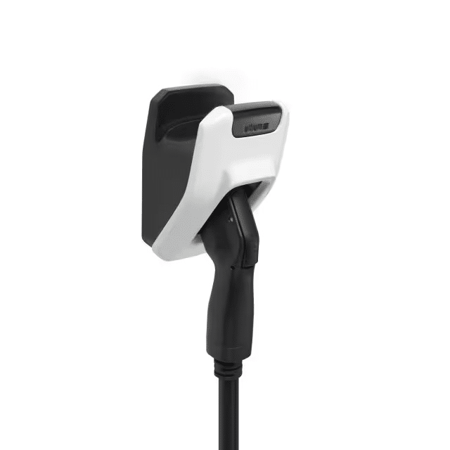 Electric vehicle charging station connector mounted on a wall, featuring a sleek design with a white and black color scheme, designed for efficient charging.