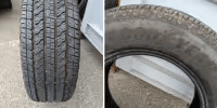 Close-up comparison of two car tires, showcasing one with deep tread for better grip and one worn down with shallow tread, emphasizing the importance of tire maintenance for safety and performance.