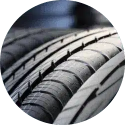 Close-up view of multiple car tires showcasing tread patterns, emphasizing durability and performance for automotive applications.