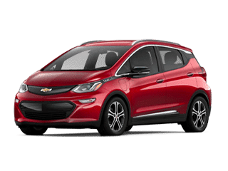 Red Chevrolet Bolt EV electric car with a modern design, showcasing its compact size and front grille, ideal for urban driving and eco-friendly commuting.