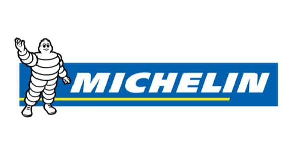 Michelin logo featuring the iconic Bibendum mascot, a white, tire-shaped character with outstretched arm, against a blue background with the word "MICHELIN" in bold yellow and white lettering. Ideal for representing quality tire products and automotive services.