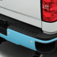 Chevrolet truck front grille featuring a distinctive turquoise accent, highlighting the modern design elements and branding of the vehicle.