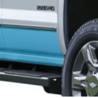Chevrolet truck front grille featuring a distinctive turquoise accent, highlighting the modern design elements and branding of the vehicle.